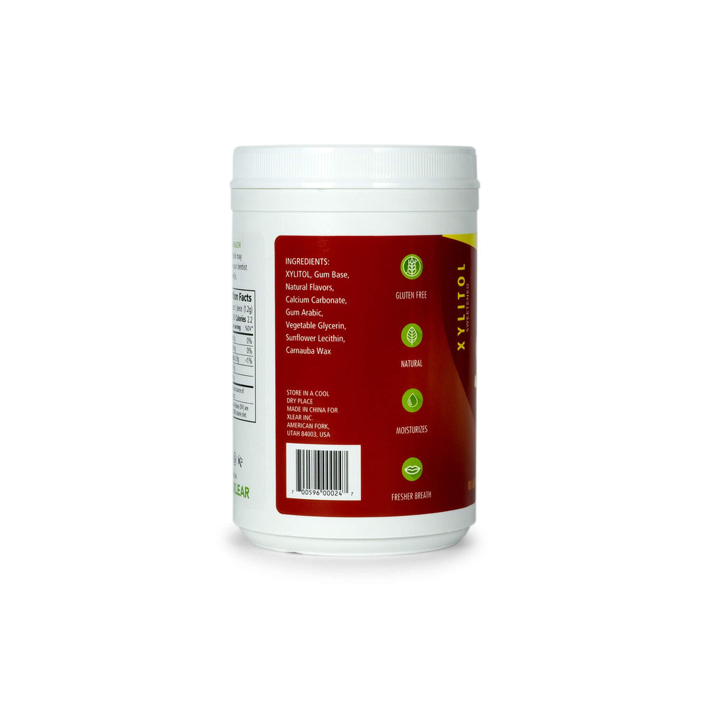 Open Spry screw-top tub with cinnamon gum pieces visible for resealable storage