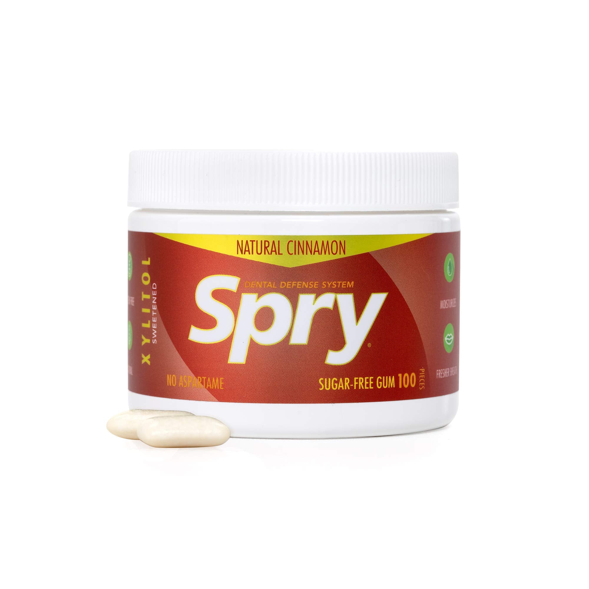 Spry cinnamon tins on a desk illustrating portability and on-the-go freshening