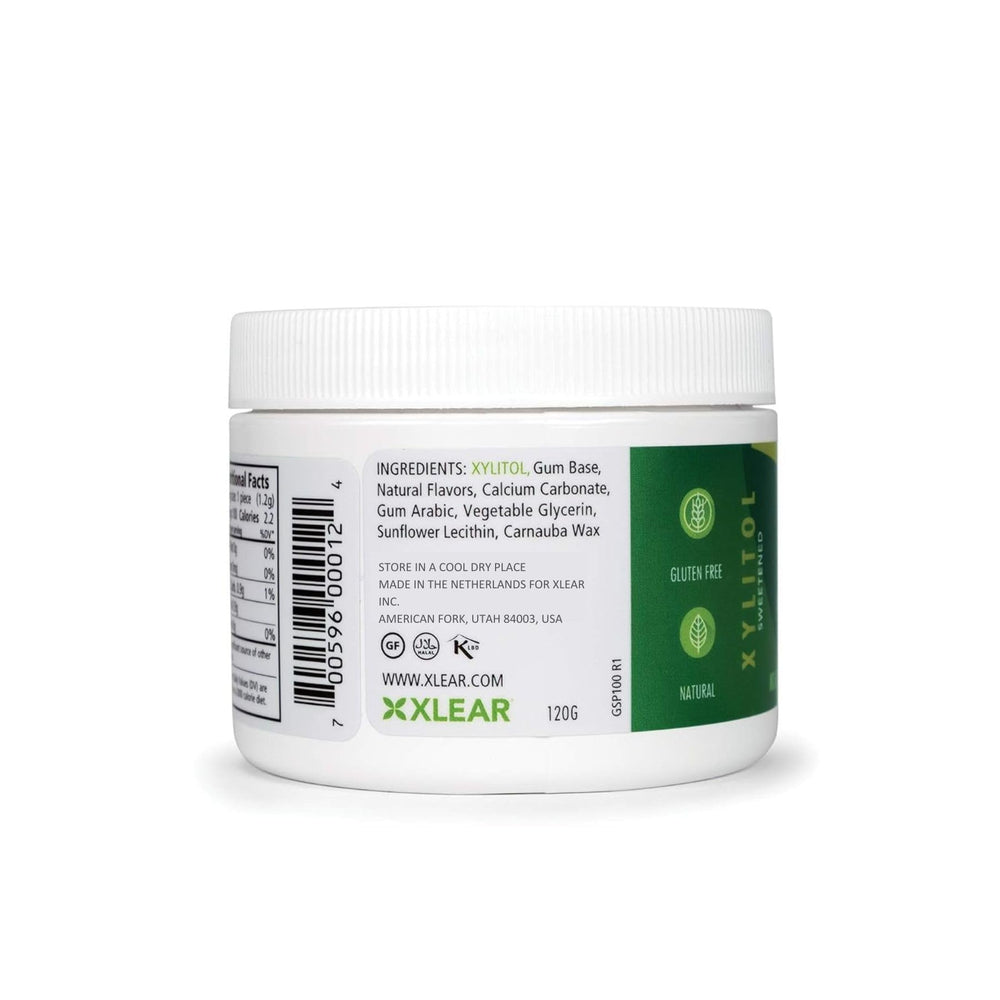 Hand holding Spry container to show size and portability for on-the-go breath freshening