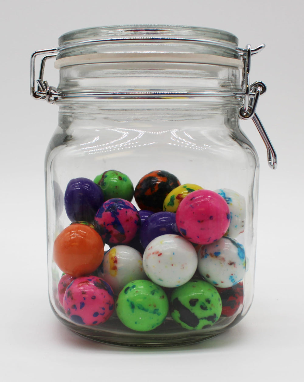 Squireboone jawbreakers on a party table showing rainbow presentation and event decoration benefit