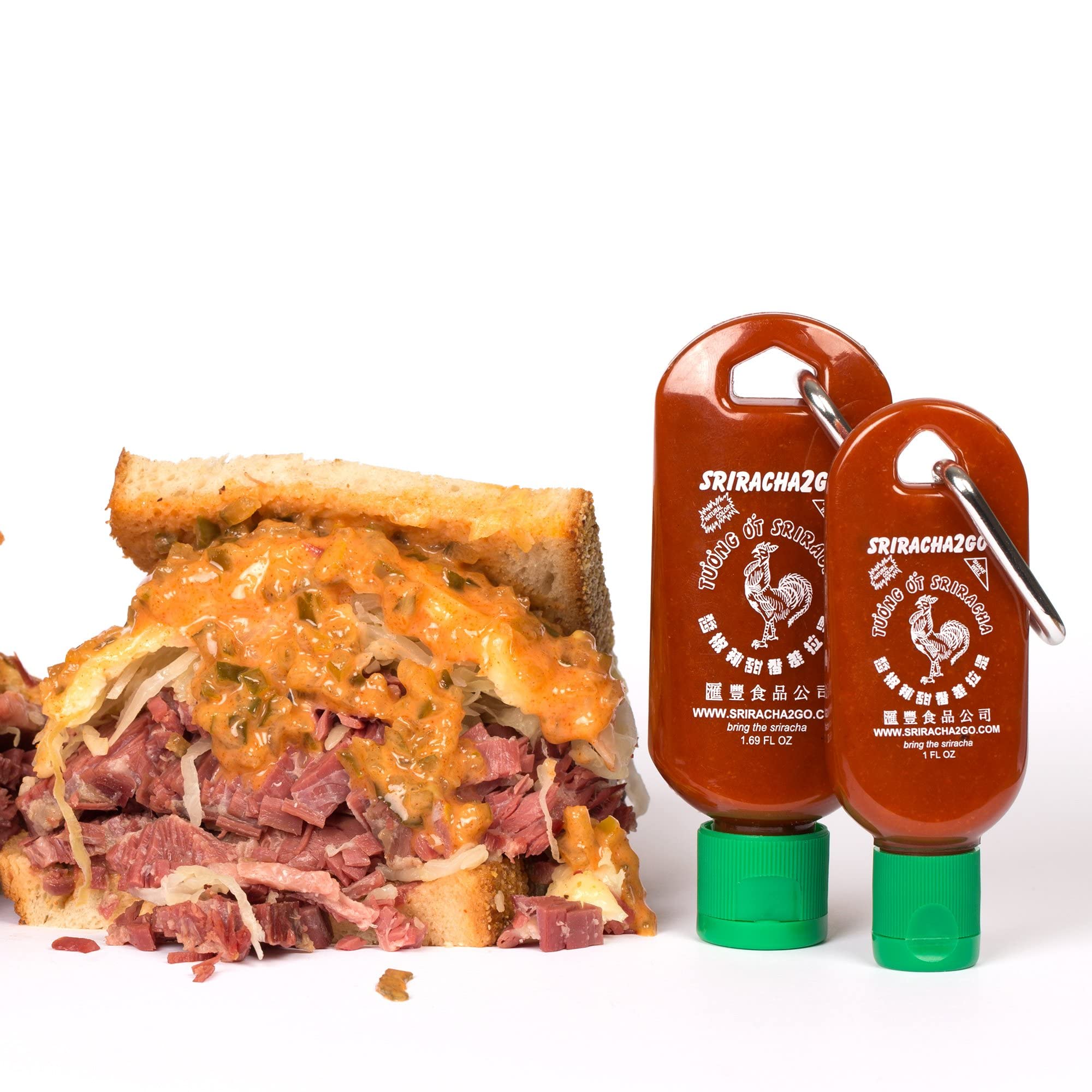 Sriracha2Go beside smartphone shows compact, pocketable size