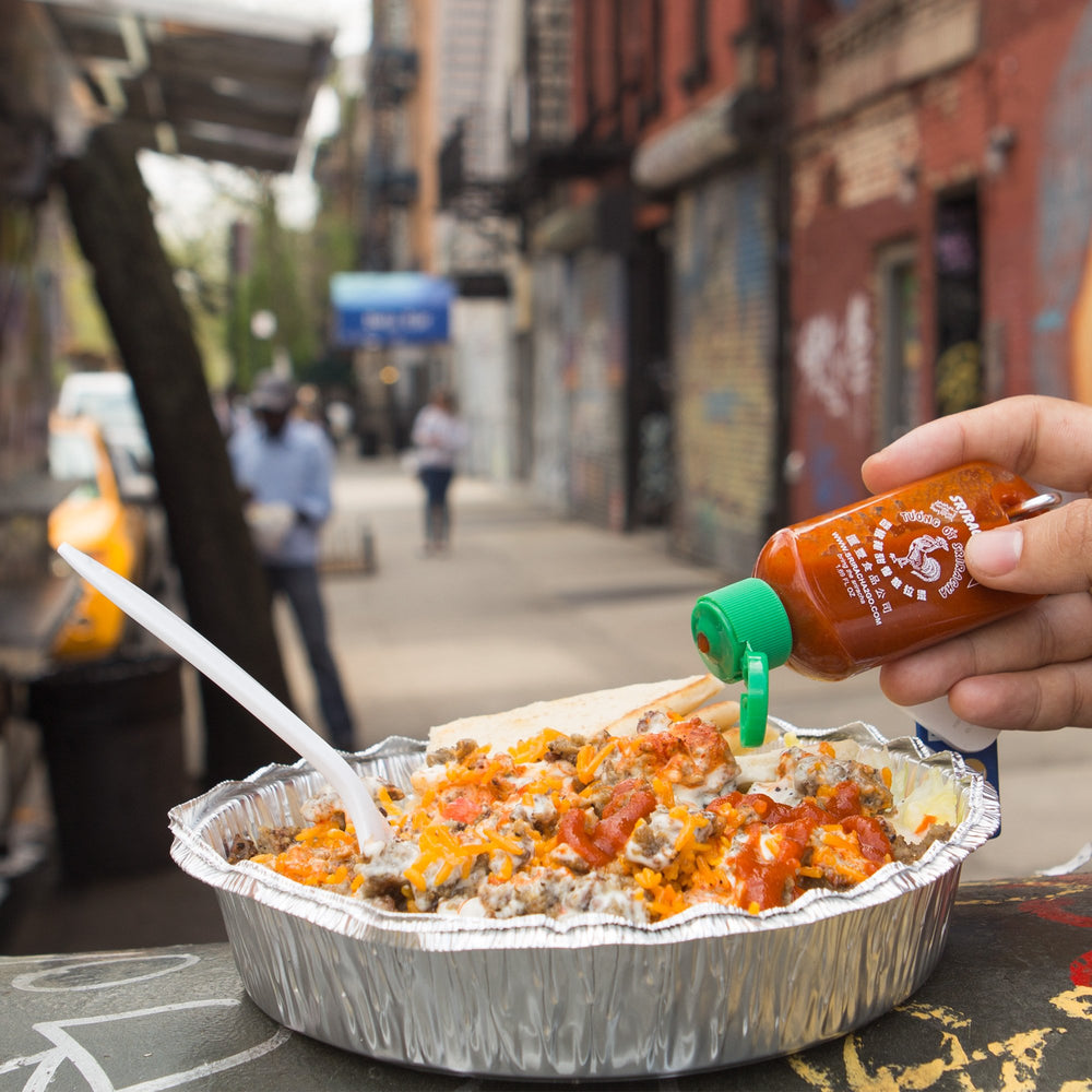 Sriracha2Go packed in travel bag emphasizes TSA-friendly convenience