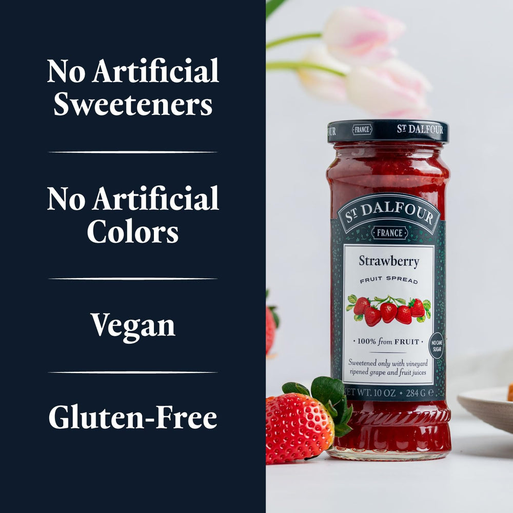 Open St. Dalfour jar with spoon showcasing spread consistency and sheen
