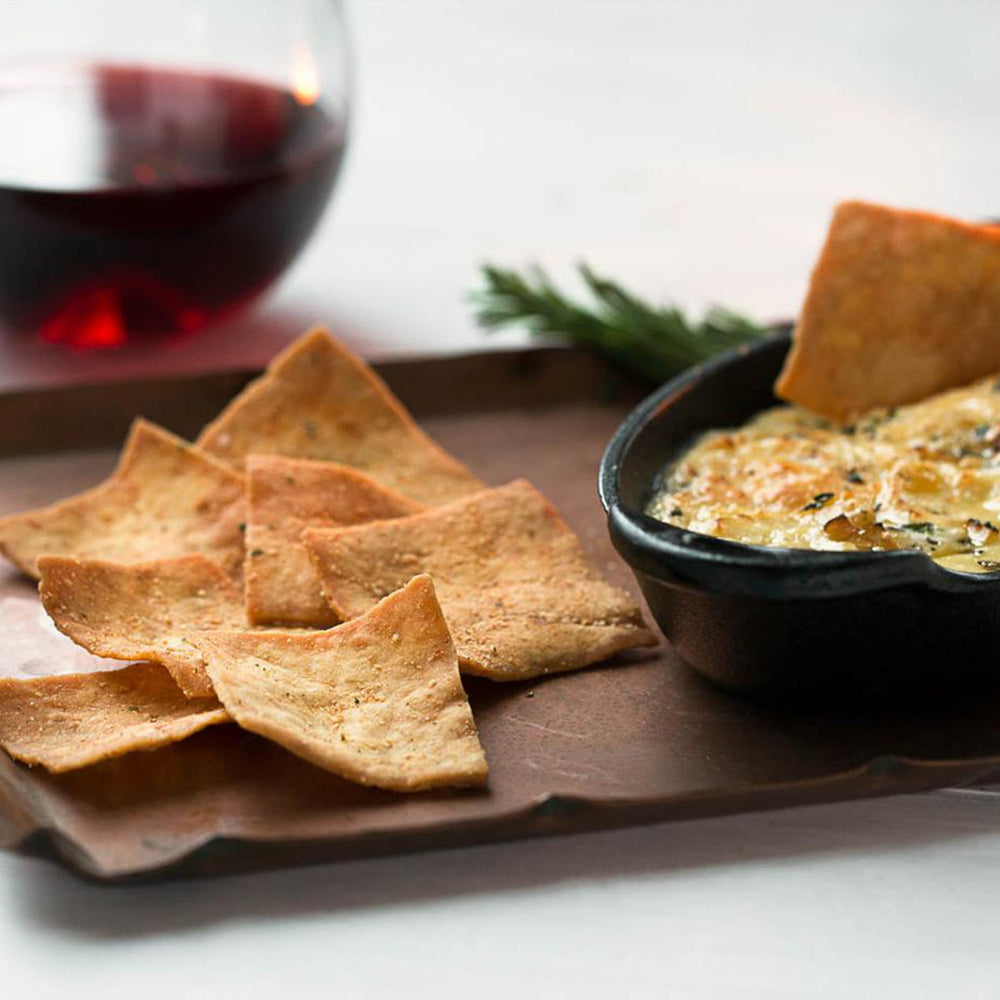 Stacy's chips arranged on a party spread illustrating easy entertaining and shareability