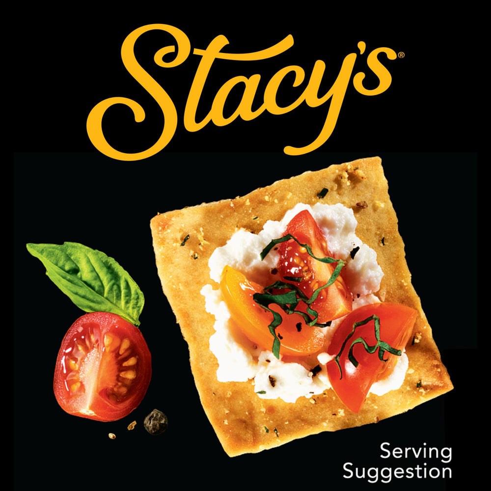 Stacy's chip bag held in hand to show serving size and portable portion benefits
