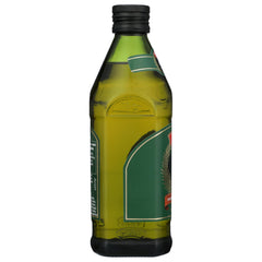 drizzle of STAR garlic EVOO over salad, enhancing freshness and flavor