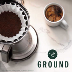 Starbucks ground coffee texture close-up showing dark roast grounds for rich extraction