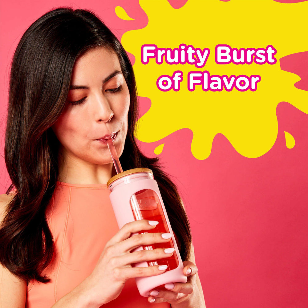 Glass of iced Starburst All Pink strawberry drink showing family-friendly zero sugar refreshment