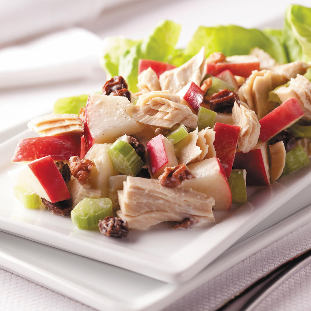 StarKist tuna being spread on sandwich illustrating simple meal prep