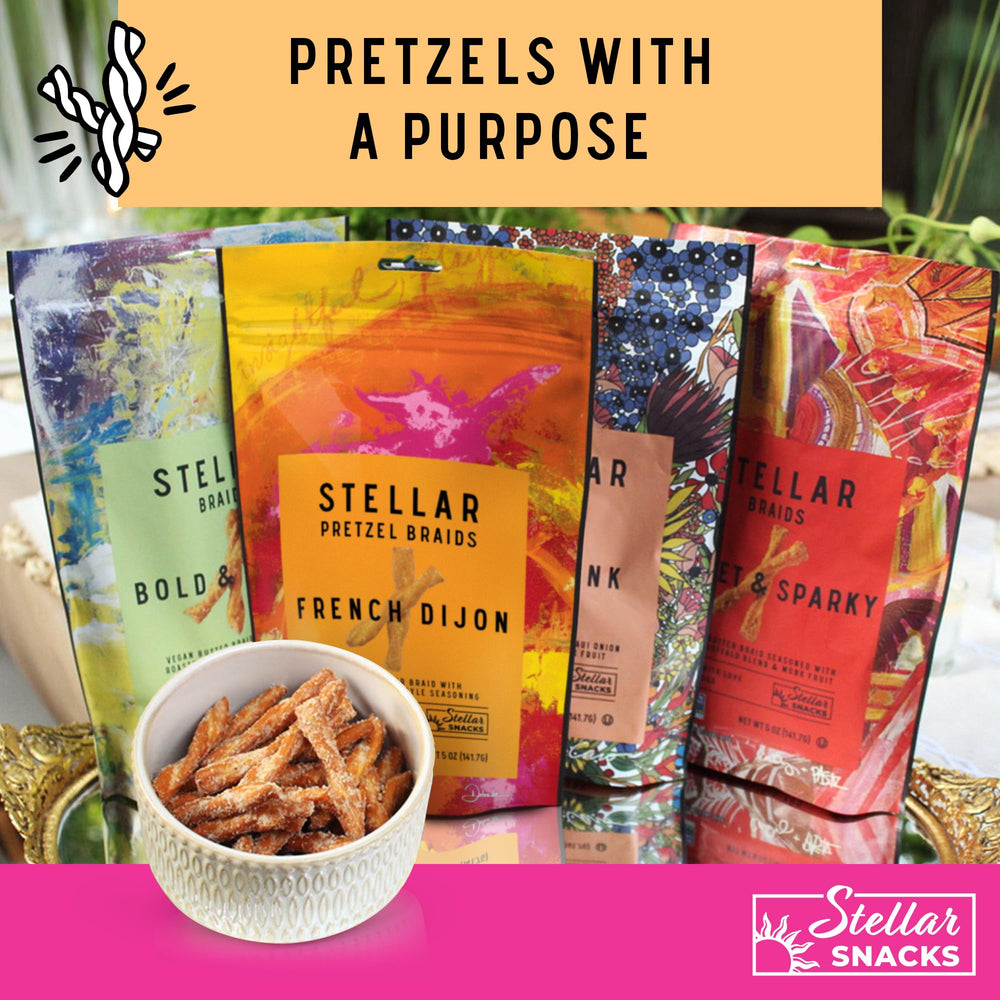 Stellar Snacks pretzel bag next to hand for scale showing generous 16 oz portion benefit