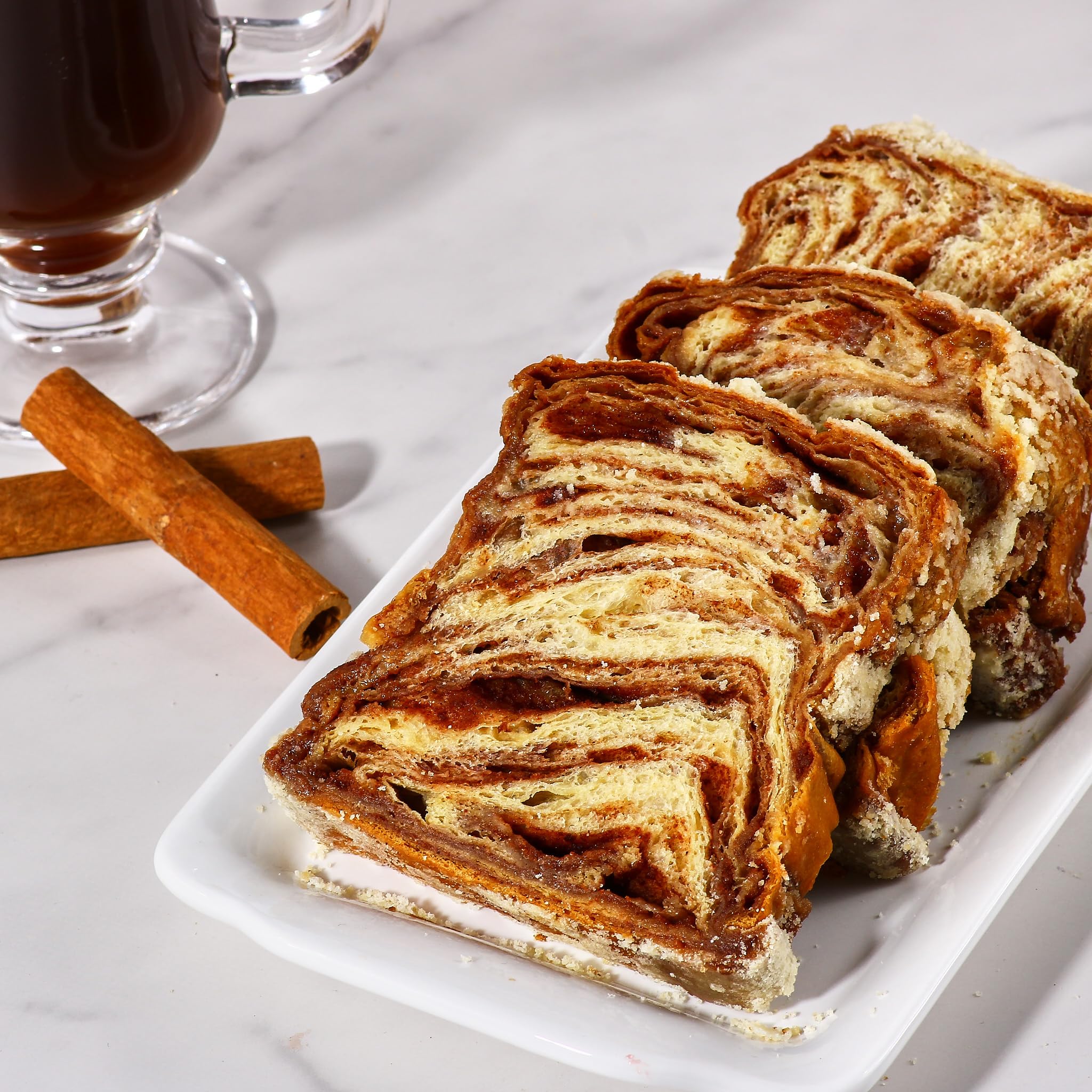 Stern's Bakery babka on breakfast table with coffee suggesting serving idea