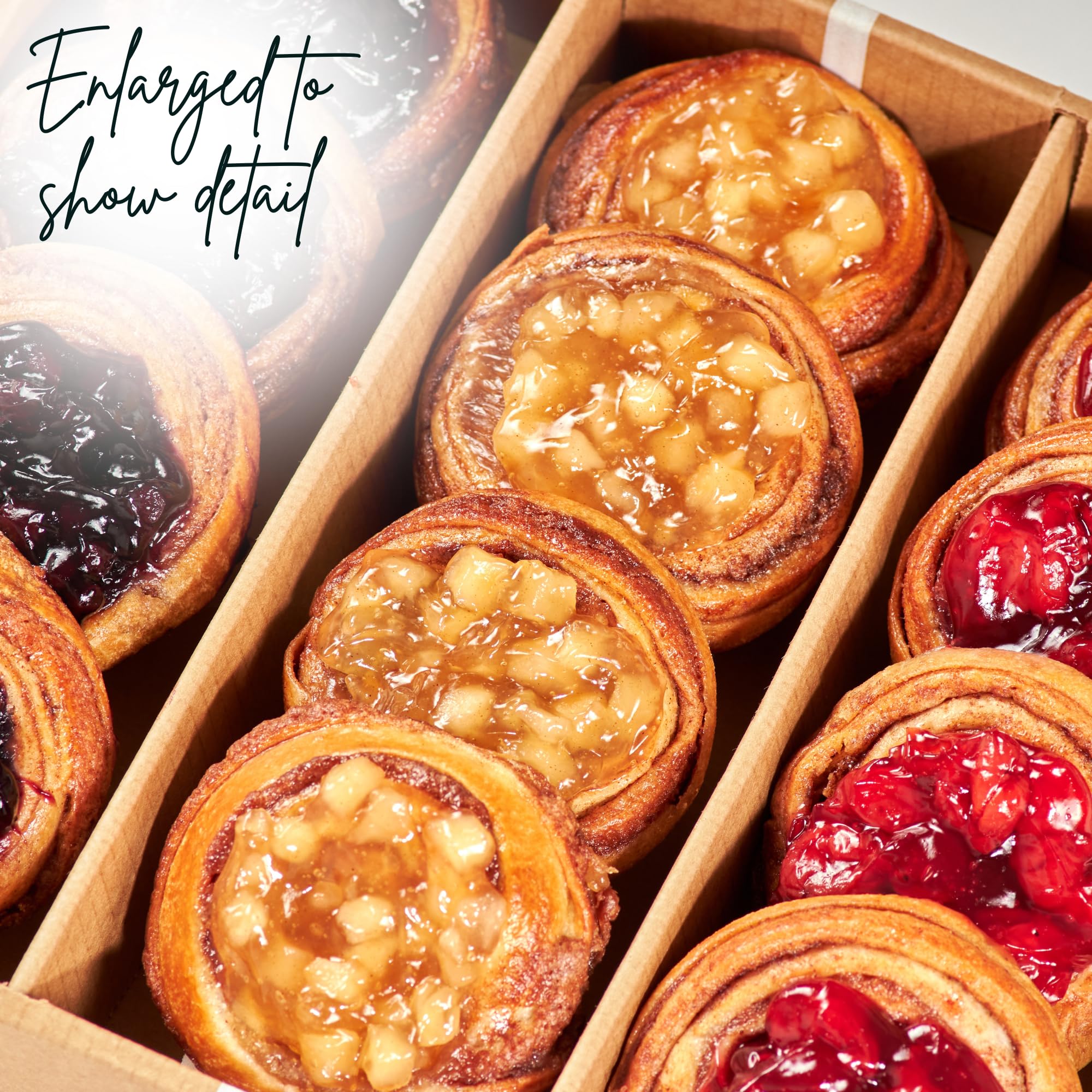 Open box interior with Stern's Bakery assorted danishes highlighting variety