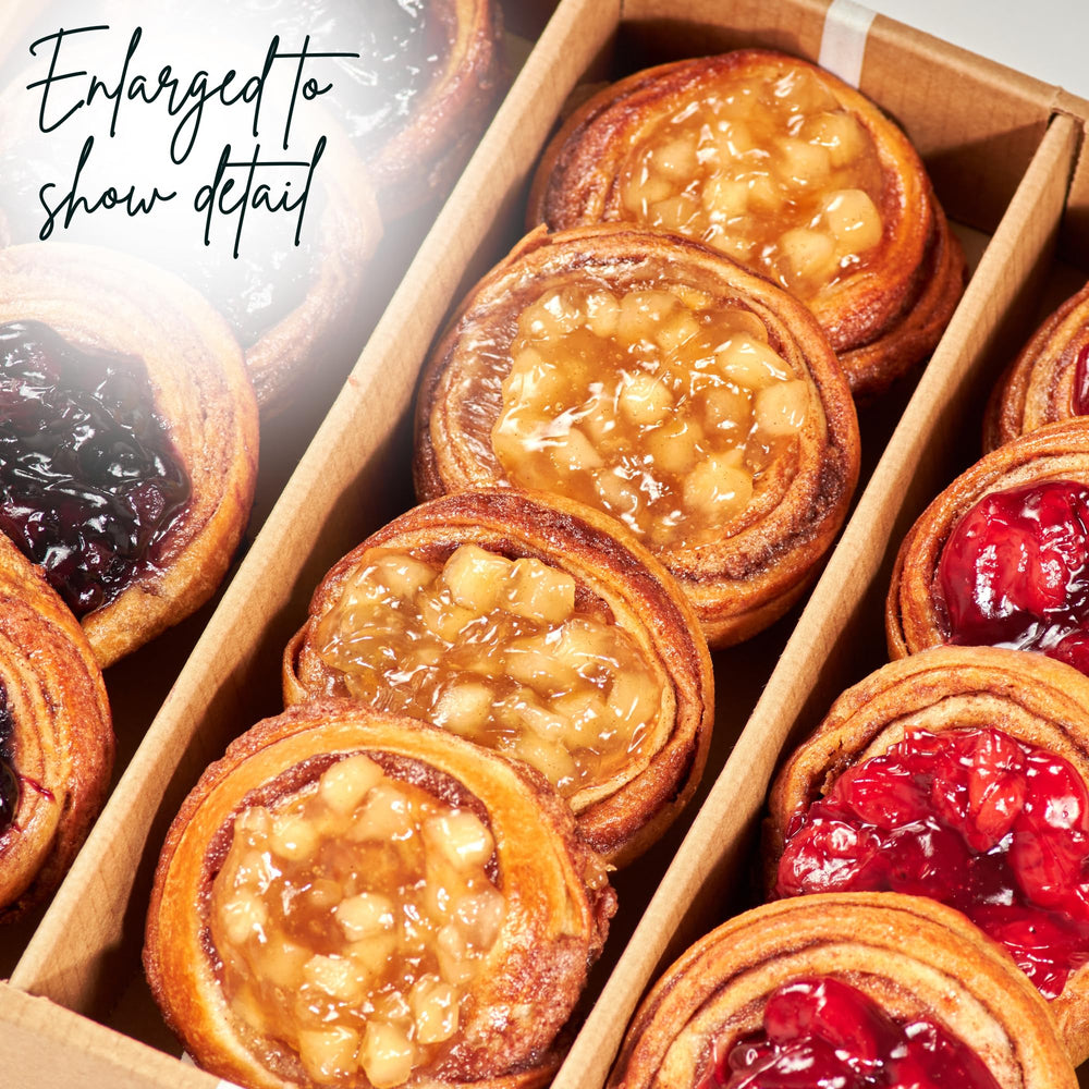 Open box interior with Stern's Bakery assorted danishes highlighting variety