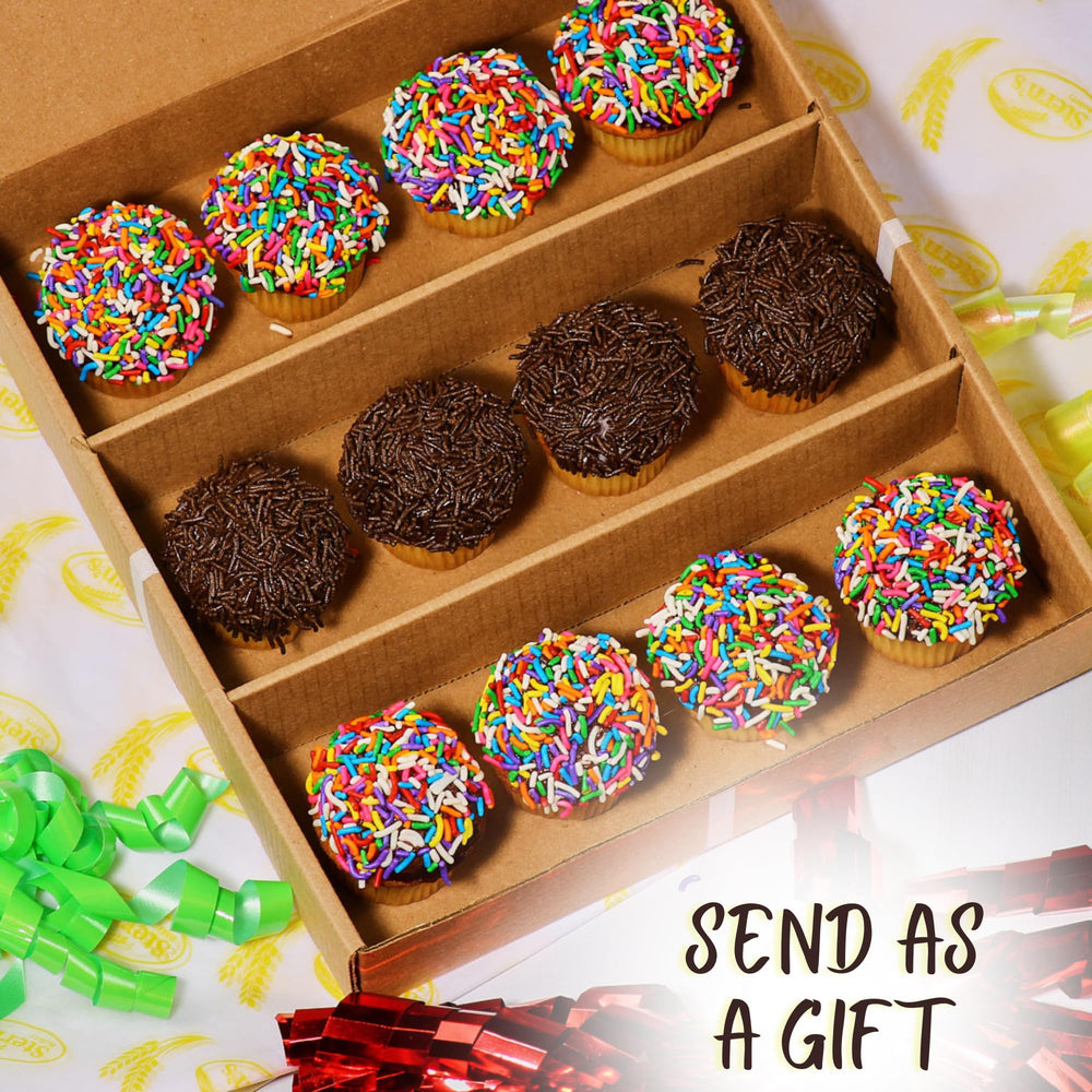 Stern's Bakery cupcake beside hand for scale, demonstrates bite-sized convenience