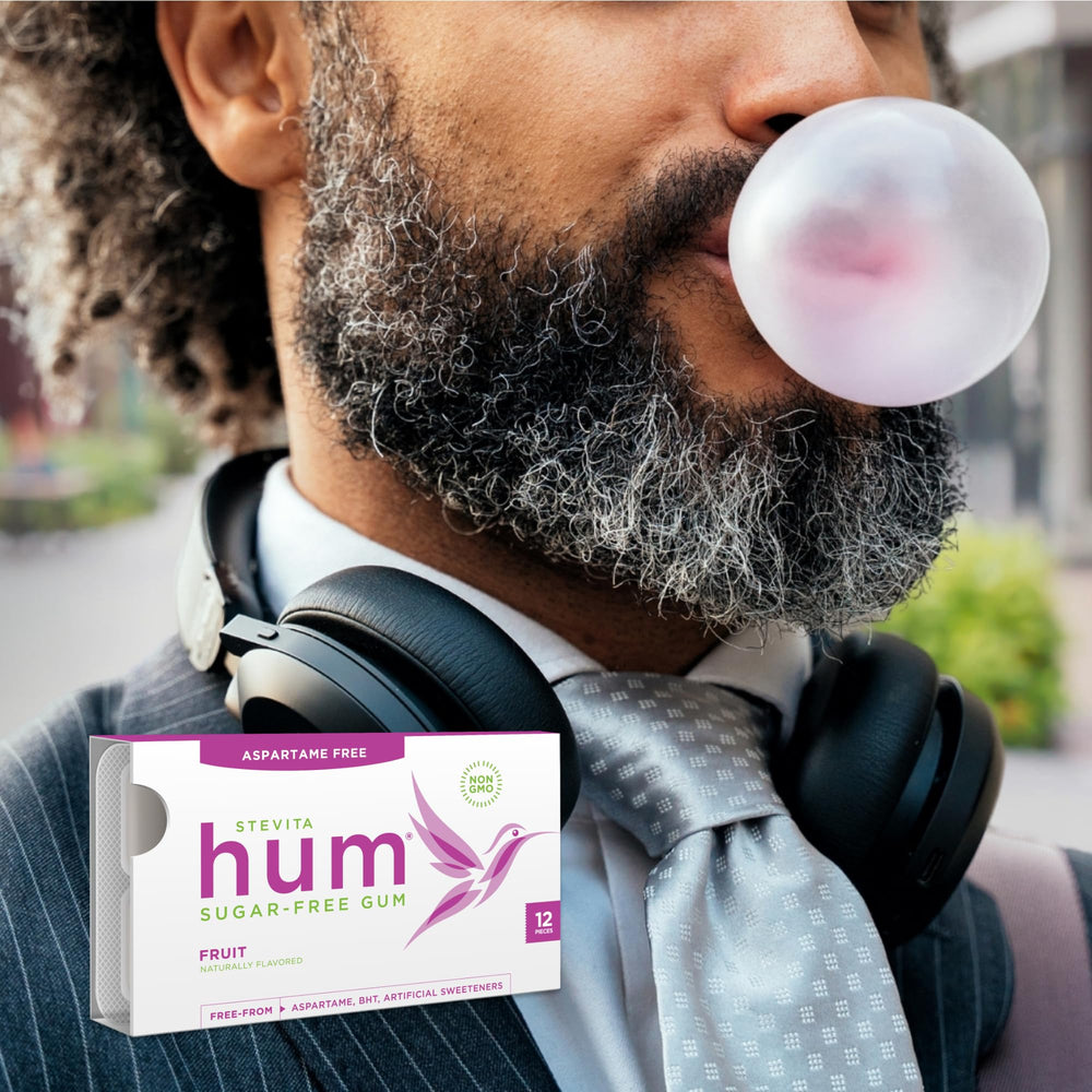 STEVITA gum in a commuter's hand for fresh breath on-the-go