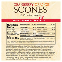 Freshly baked cranberry orange scone made from Sticky Fingers mix on plate, flaky texture and bright flavor