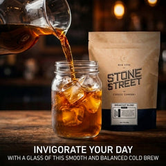 Stone Street cold brew being poured into a glass over ice for refreshing morning coffee