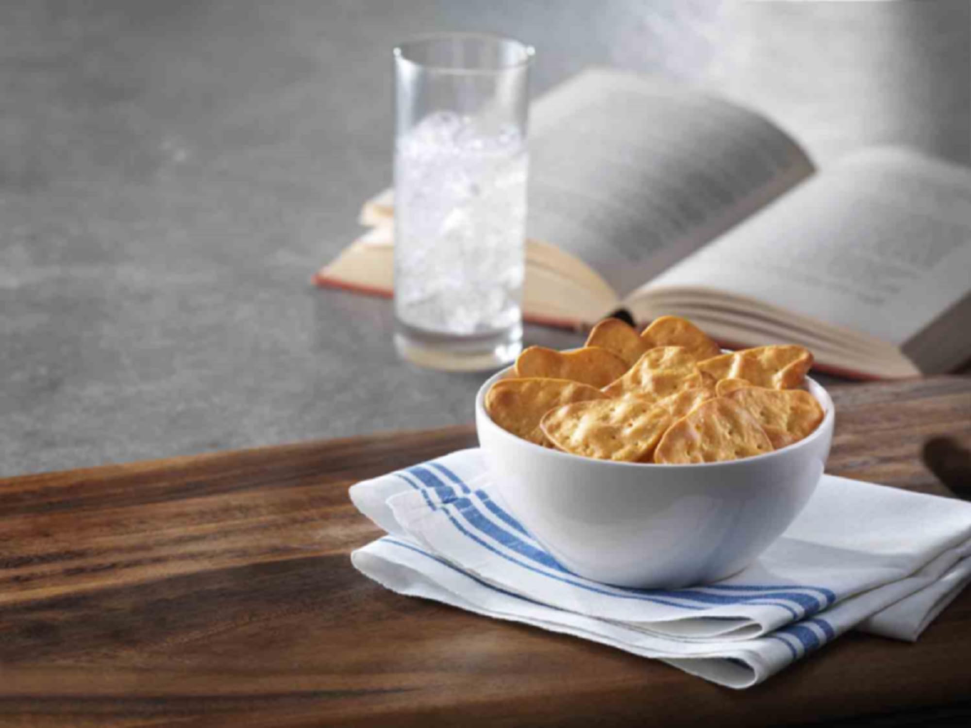 Stonefire crisp held in hand showing scale and easy on-the-go snack benefit