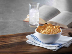 Stonefire crisp held in hand showing scale and easy on-the-go snack benefit