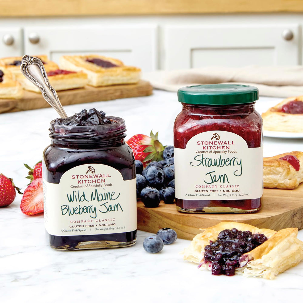 Stonewall Kitchen jam duo arranged on cheese board adding sweet-savory contrast