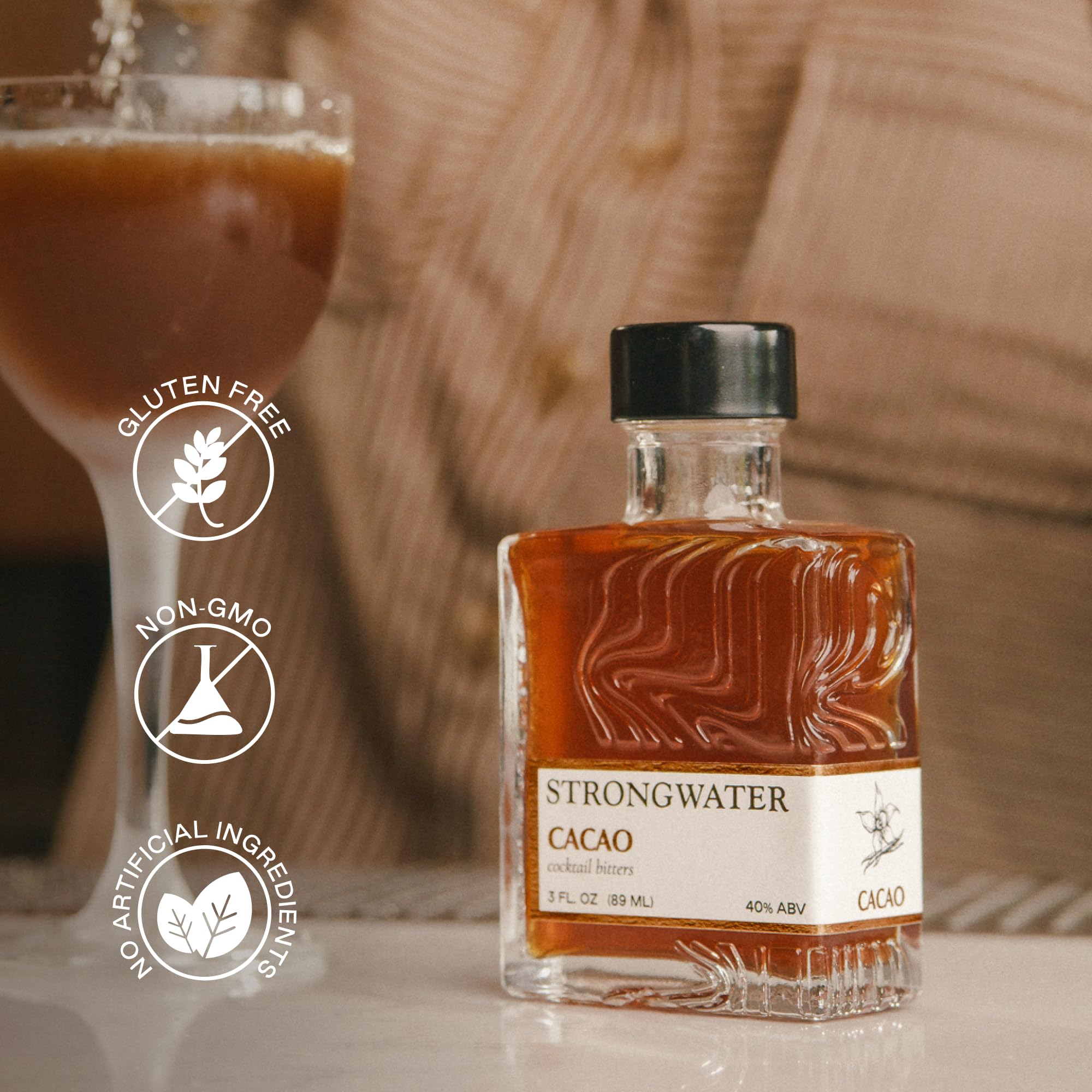Old Fashioned cocktail finished with bitters made using Strongwater cacao bottle