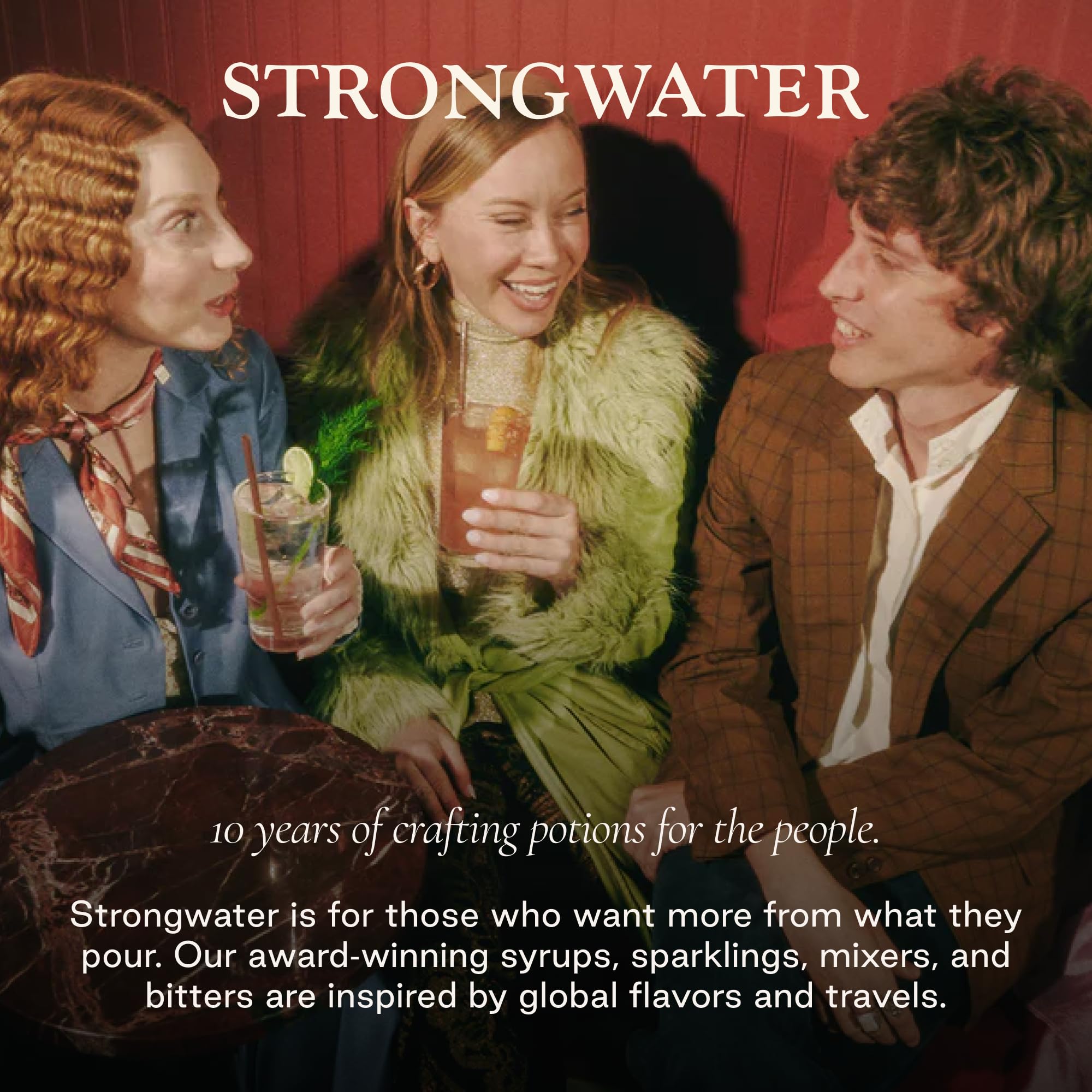 Cocktail glass with Strongwater bitters in a cozy home bar illustrating serving inspiration