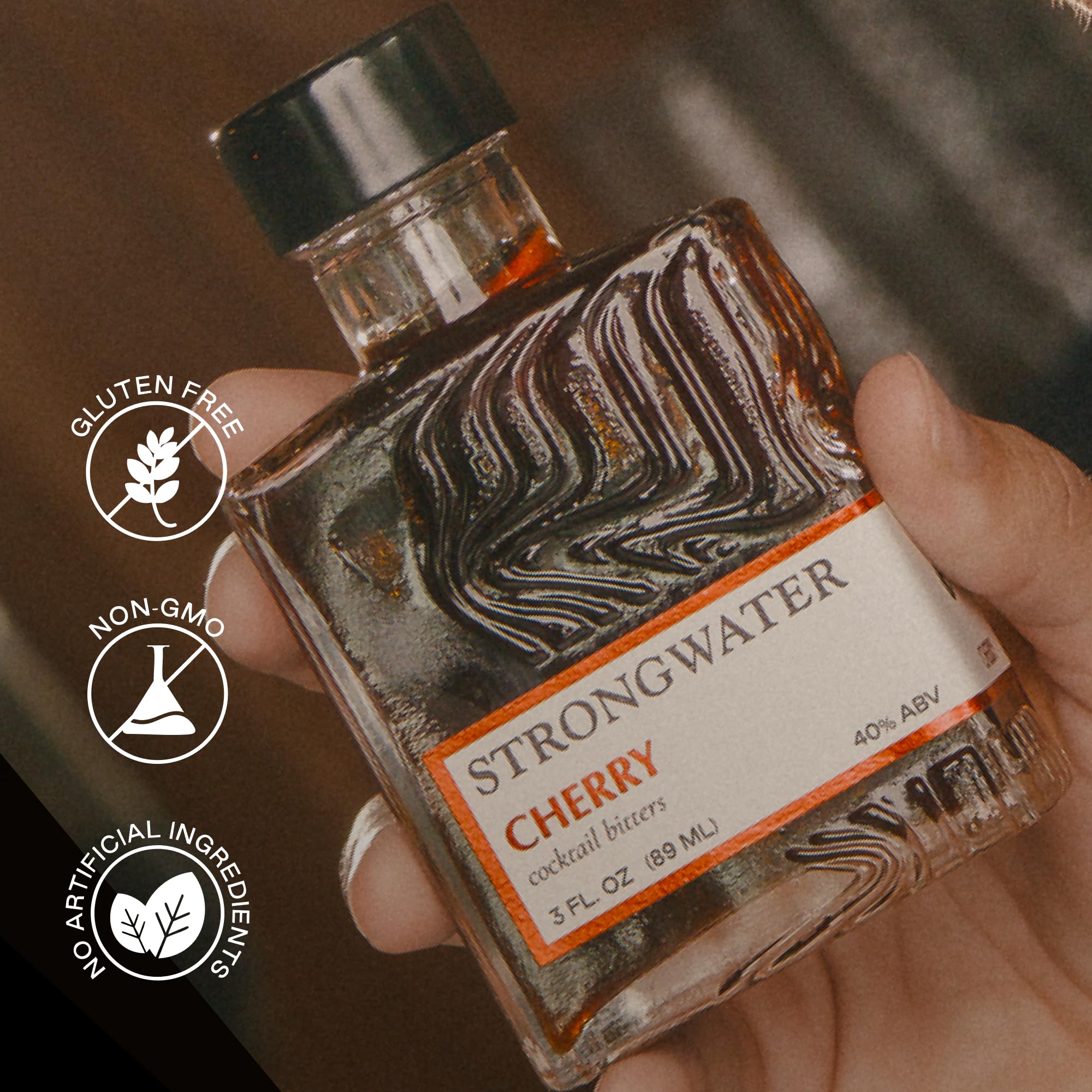 Strongwater bitters being added to an Old Fashioned for enhanced cherry aroma