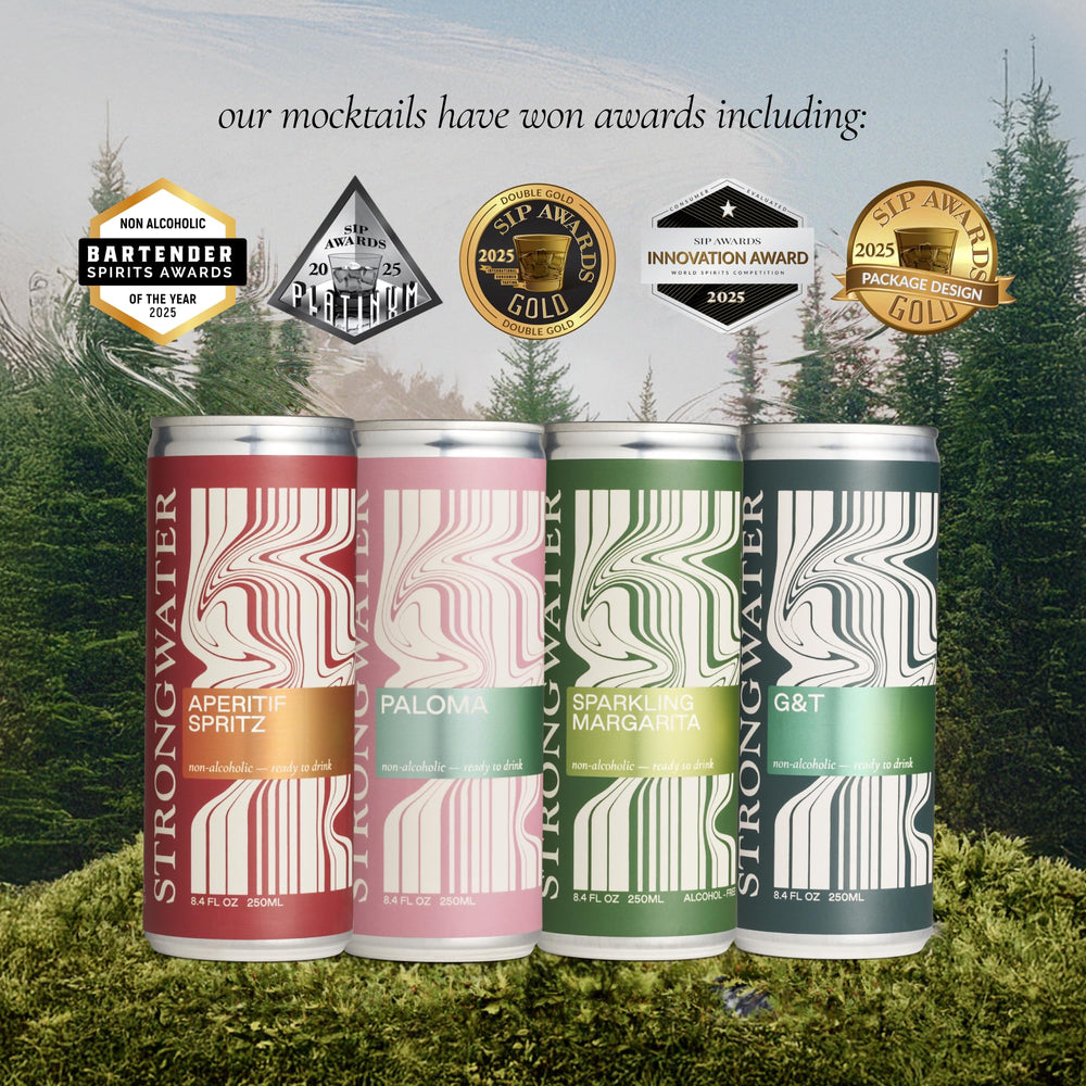 Strongwater cans beside fresh citrus to show true ingredient scale
