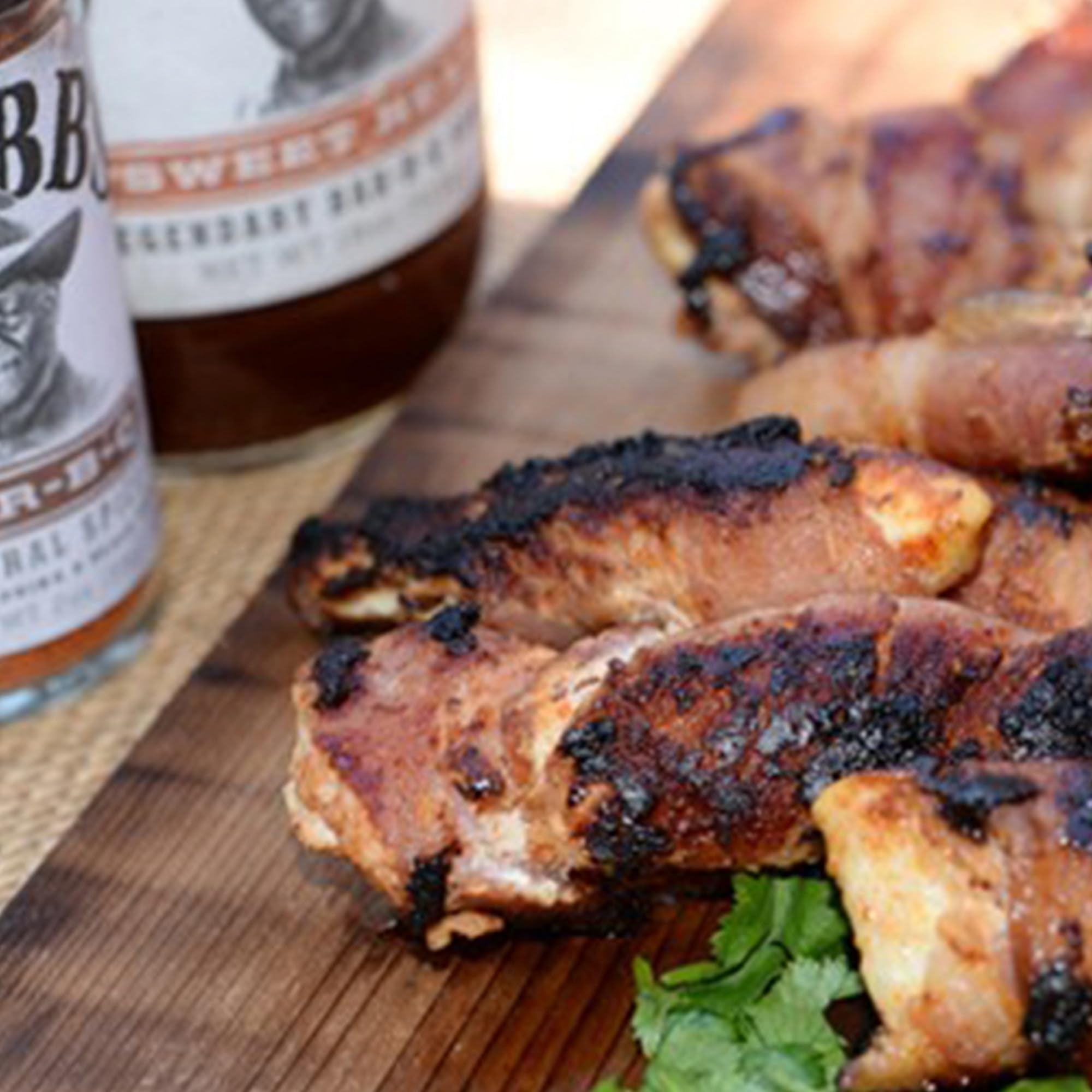Flatlay of molasses, brown sugar, and chipotle near Stubb's bottle showcasing ingredients