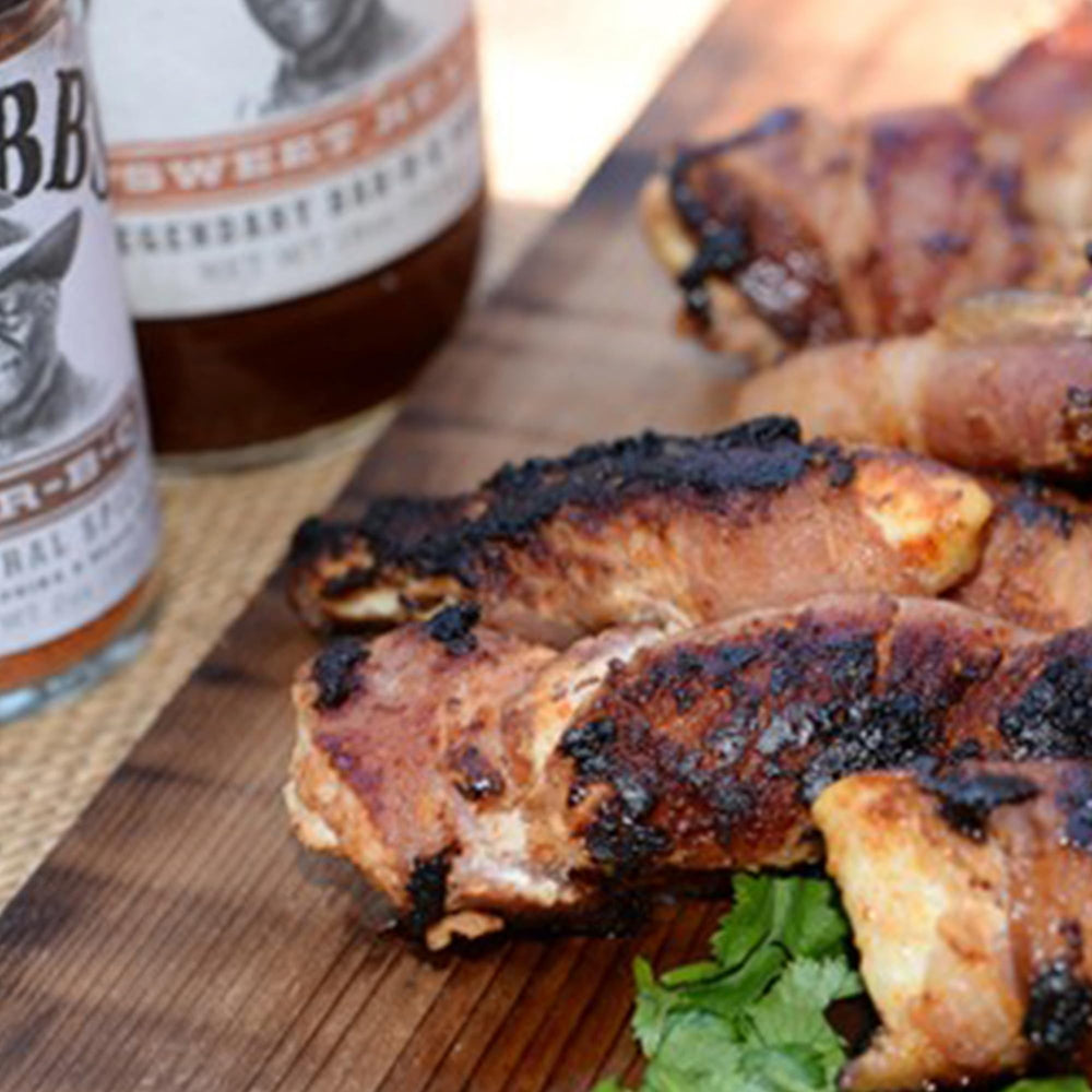 Flatlay of molasses, brown sugar, and chipotle near Stubb's bottle showcasing ingredients