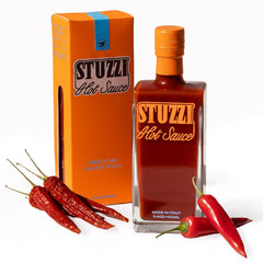 Stuzzi Hot Sauce front label showing brand and medium heat — elegant gift appeal