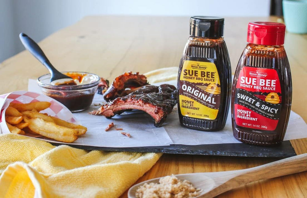 Sue Bee bottle beside common kitchen items showing 14-ounce scale benefit