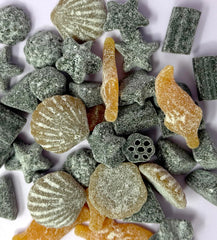 Sugarloo World licorice pieces in hand, demonstrates soft chewability for easy snacking