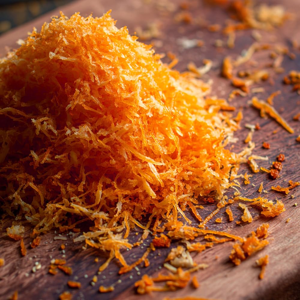 Supreme Bottarga plated in kitchen scene showing gourmet finishing touch