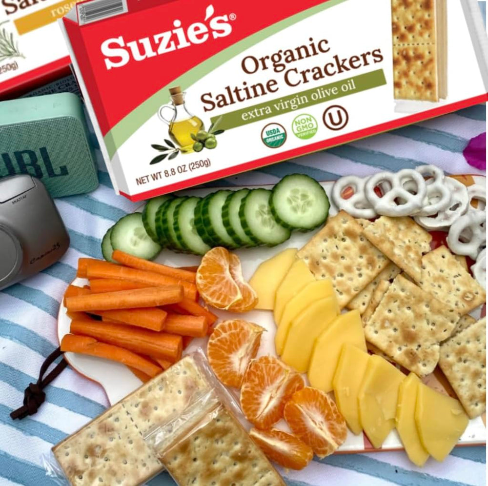 SUZIE'S cracker held in hand to show portion size and portable snack benefit