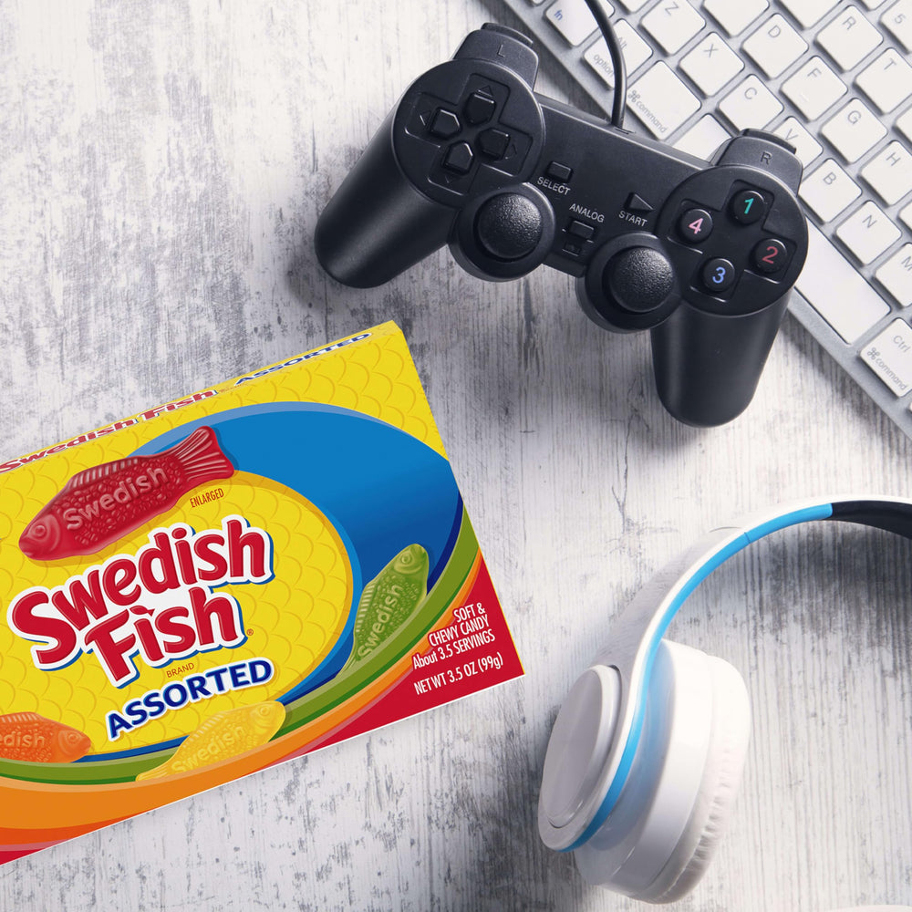 Swedish Fish tucked into a backpack pocket to show travel-ready snacking convenience