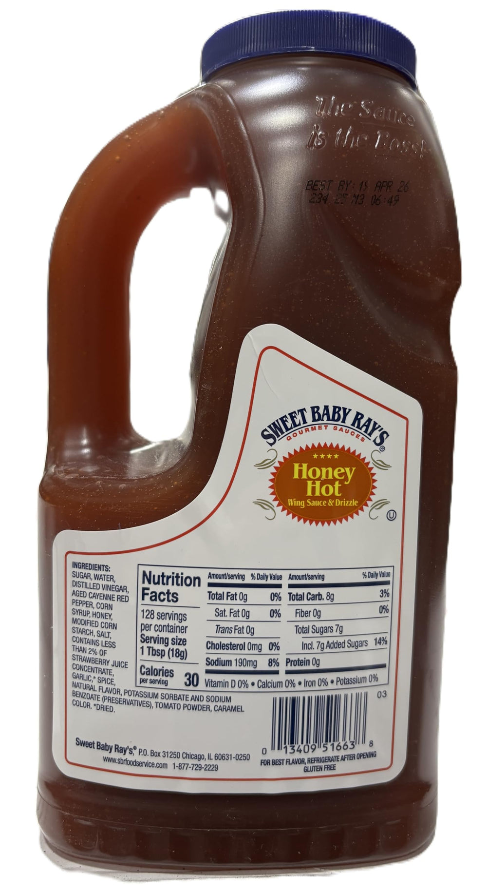 Sweet Baby Ray's pouring honey hot sauce over wings for glossy flavor boost