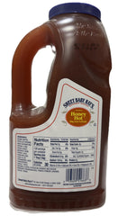 Sweet Baby Ray's pouring honey hot sauce over wings for glossy flavor boost