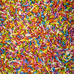 Sweet Eva’s sprinkles on a frosted cupcake adding vibrant color and party-ready appeal