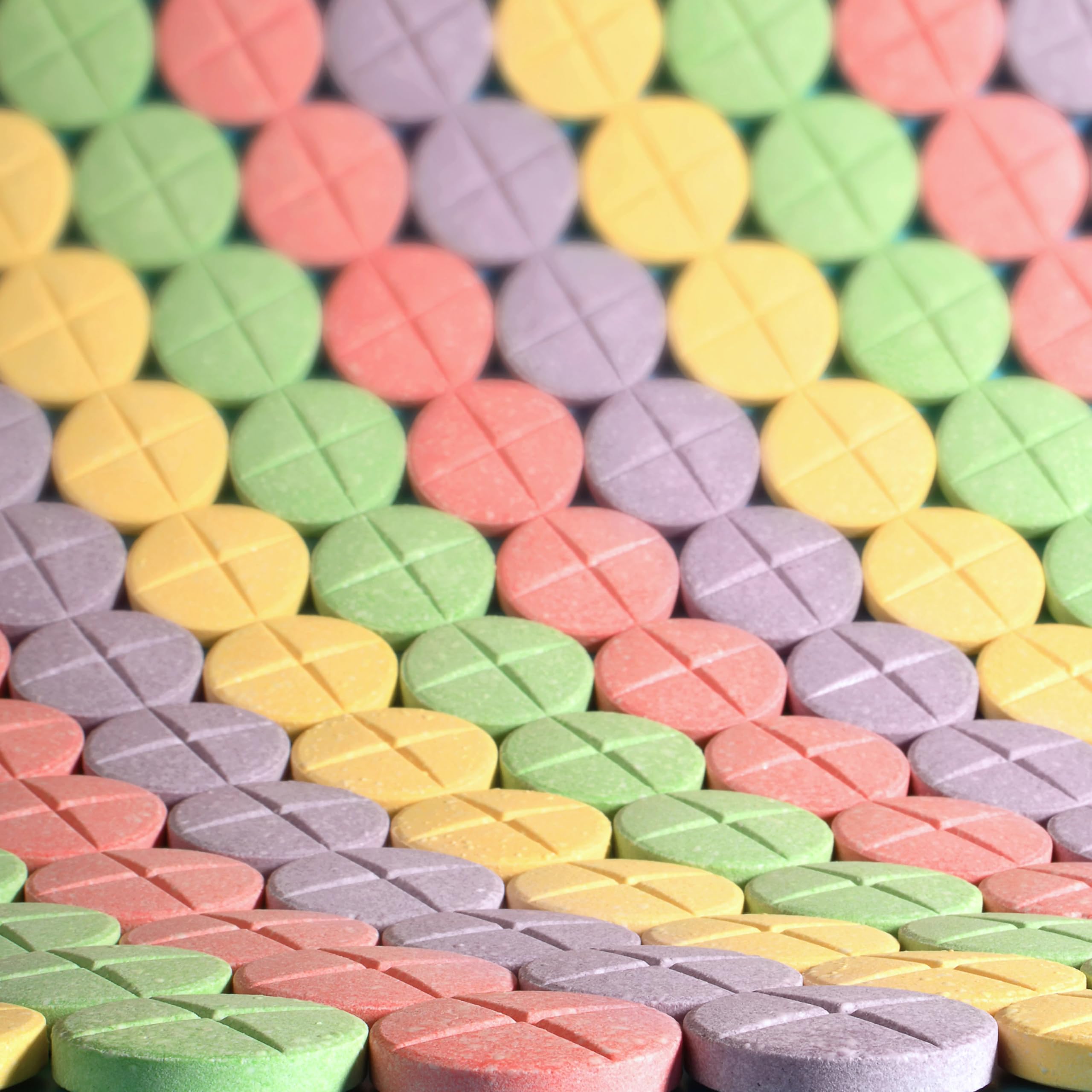 SweeTARTS next to a coin to show size and portion clarity