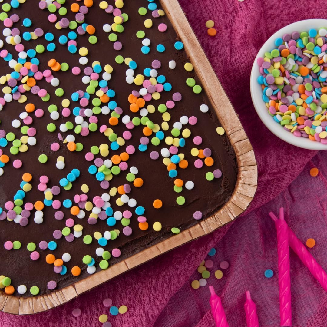 Sweets Indeed on a party table styled with desserts to inspire event decorating