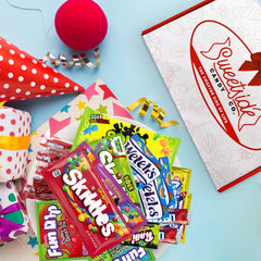 SWEETSIDE CANDY CO. box beside hand to show size and convenience for mailing