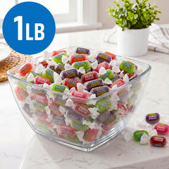 SWEETSIDE CANDY CO. hand holding candies demonstrating portable, on-the-go convenience
