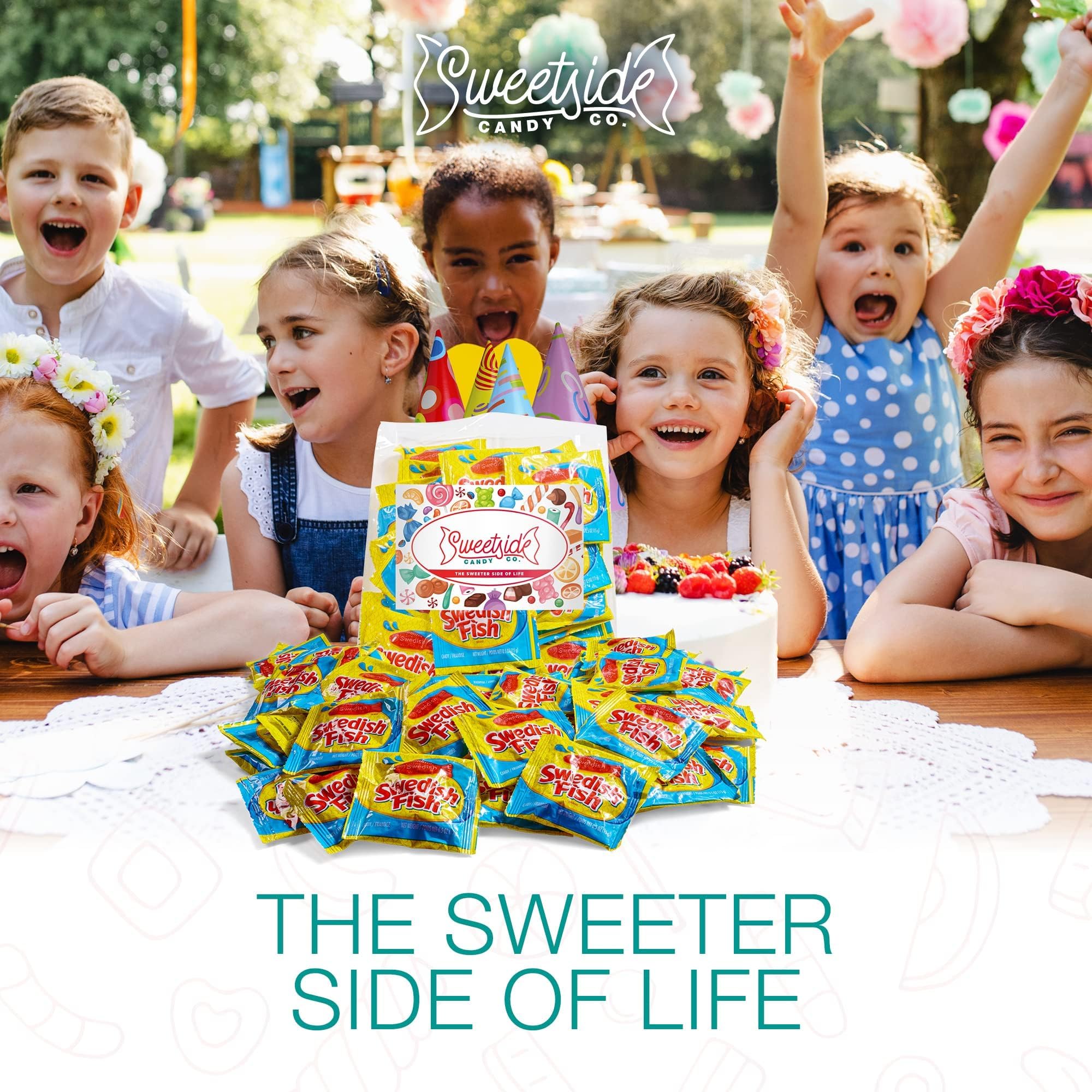 SWEETSIDE CANDY CO. handful of mini fish candies showing size and scale benefit: convenient snack
