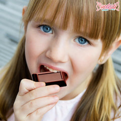 SWEETSIDE CANDY CO. mini bar beside ruler showing size and convenient single-serve benefit