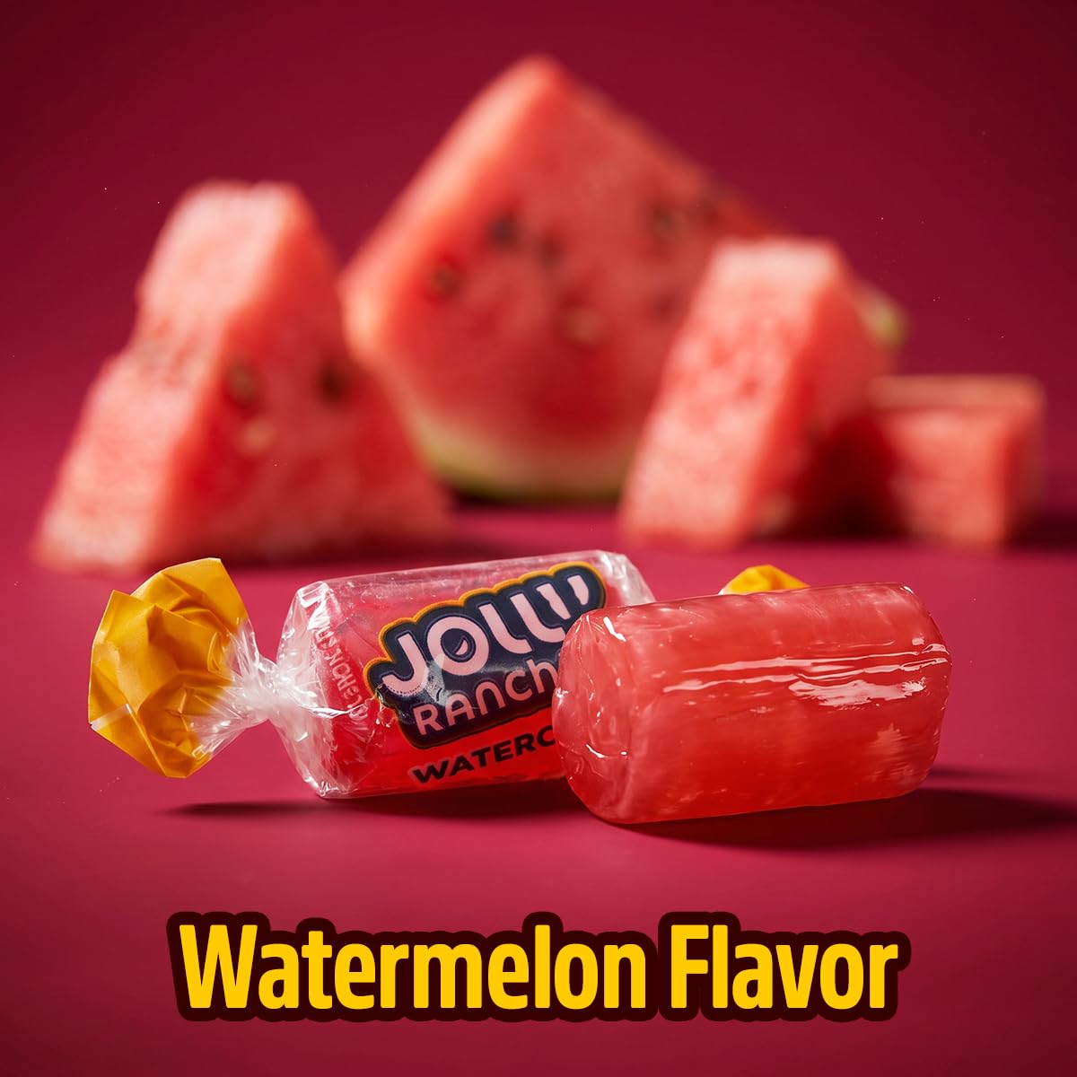 SWEETSIDE CANDY CO. hand holding a watermelon hard candy, demonstrates easy on-the-go snacking