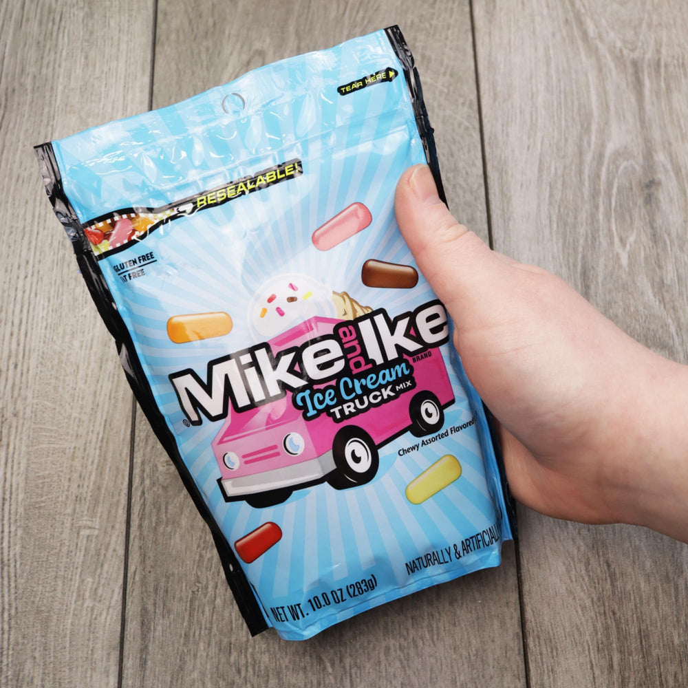 Sweetzo Mike and Ike shown in hand for scale illustrating convenient 10-ounce resealable size