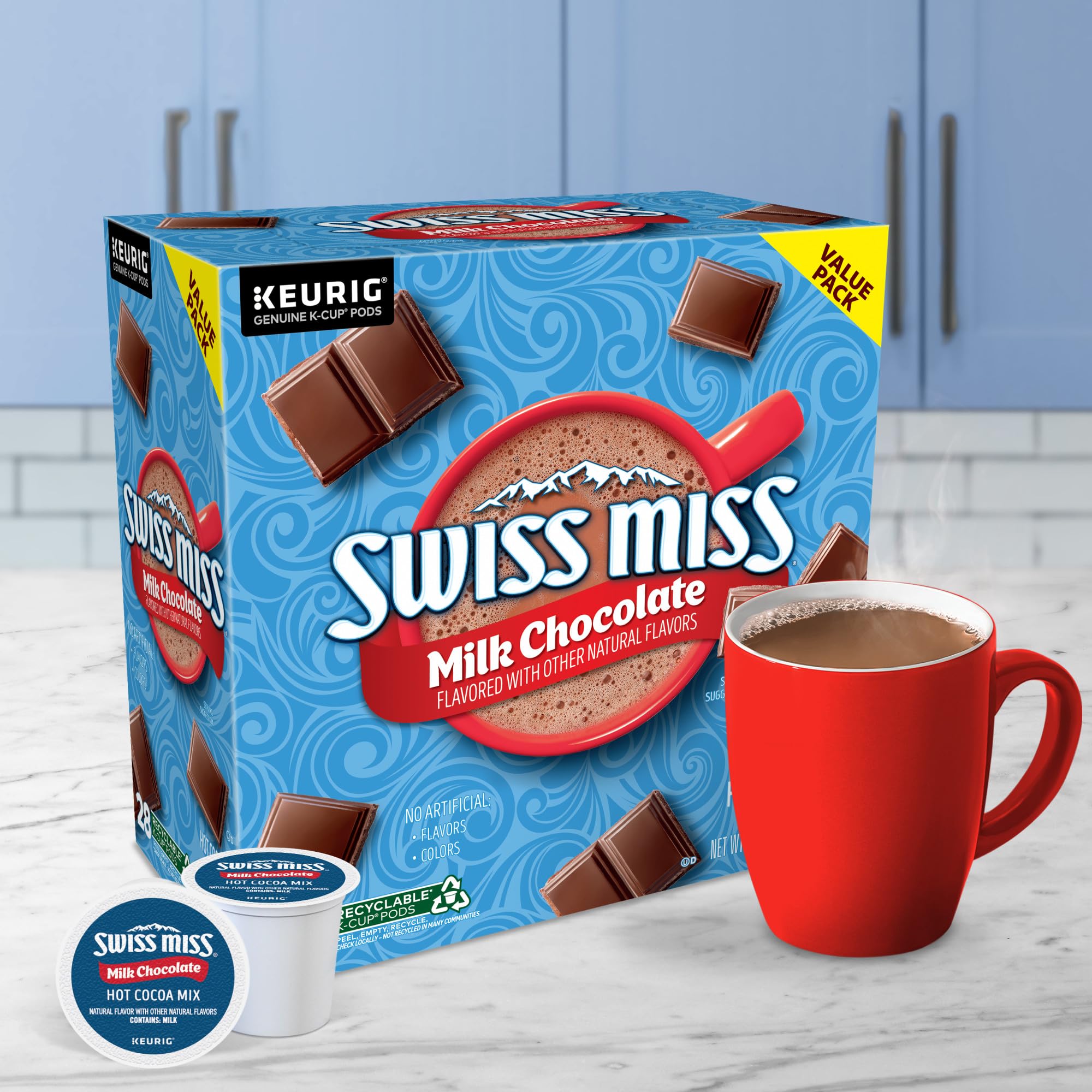 Swiss Miss pod beside ruler showing size comparison and single-serve portion