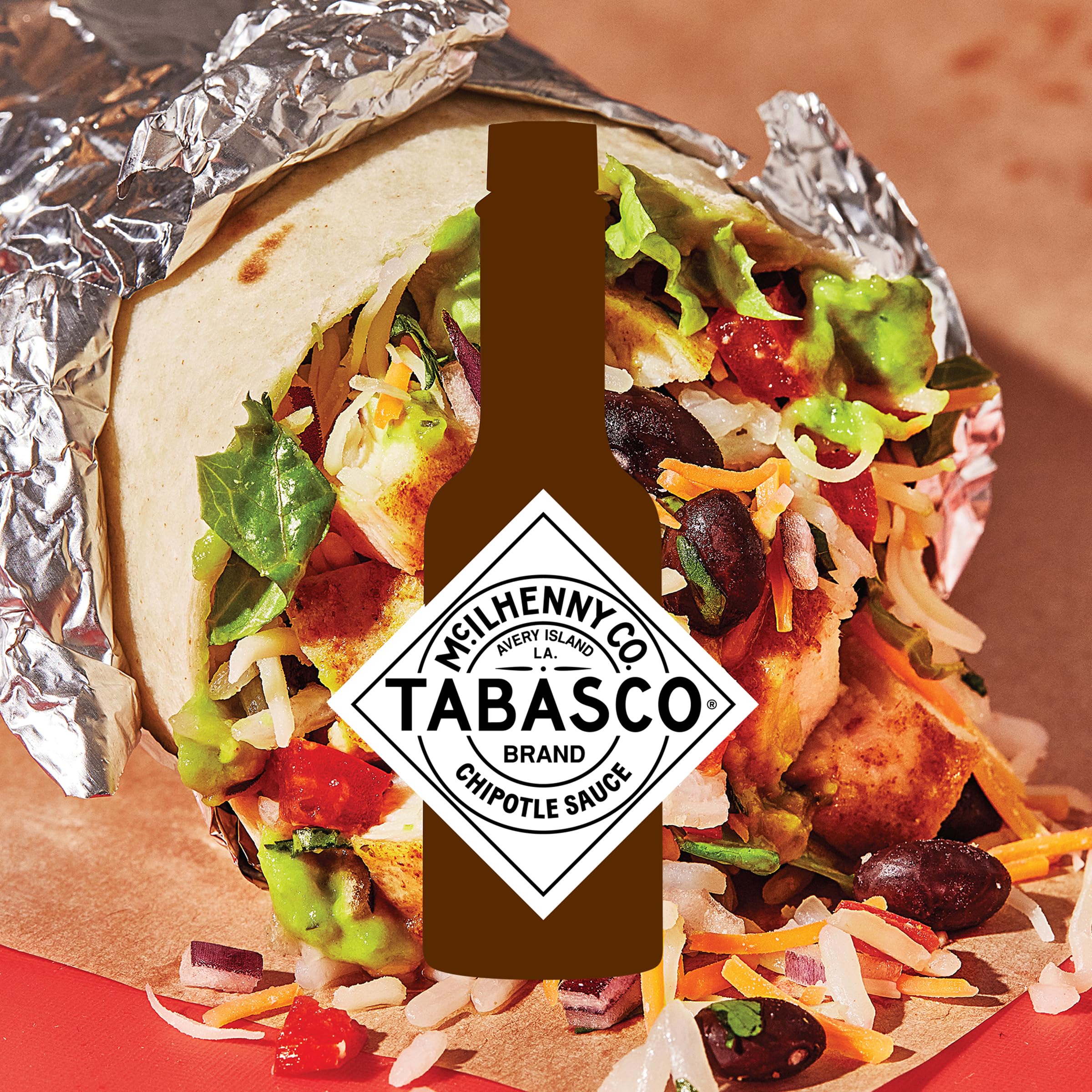TABASCO sauce drizzled on taco adding smoky flavor and visual appeal
