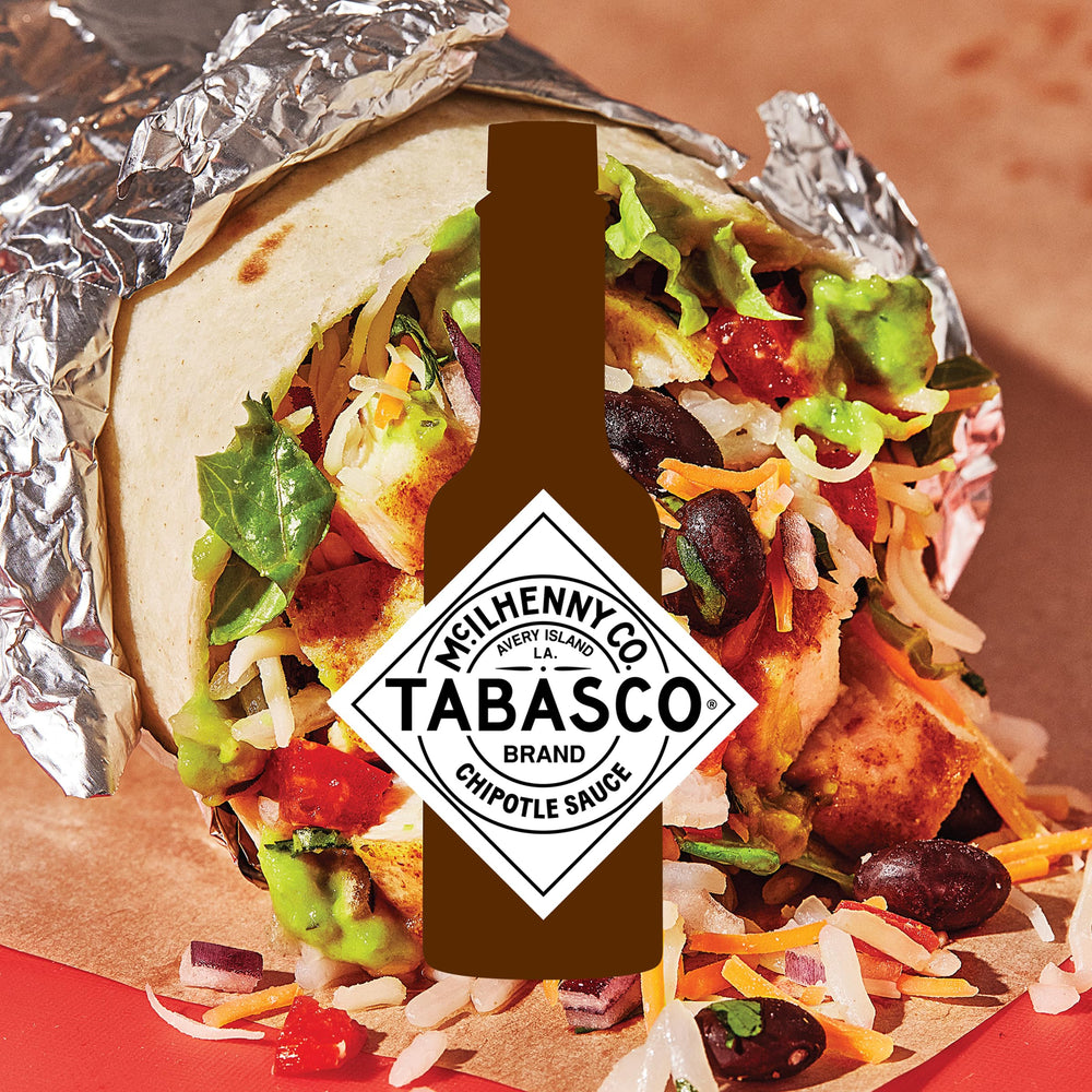 TABASCO sauce drizzled on taco adding smoky flavor and visual appeal